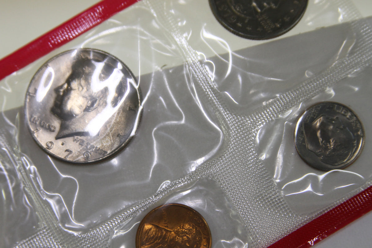 Detailed view of 1979 U.S. Mint coins in original red-sealed packaging