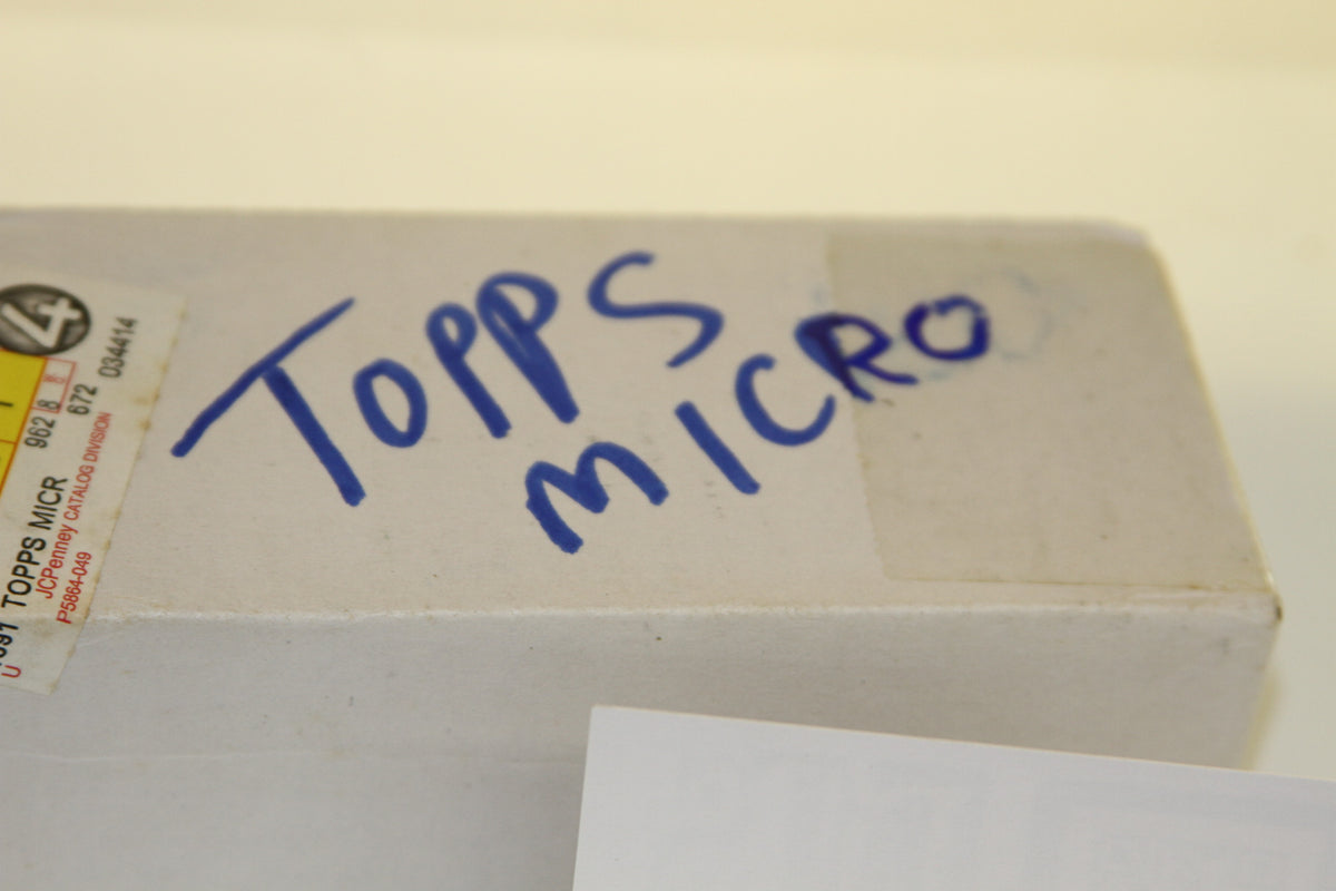Handwritten 'Topps Micro' on white box top
