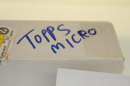 Handwritten 'Topps Micro' on white box top