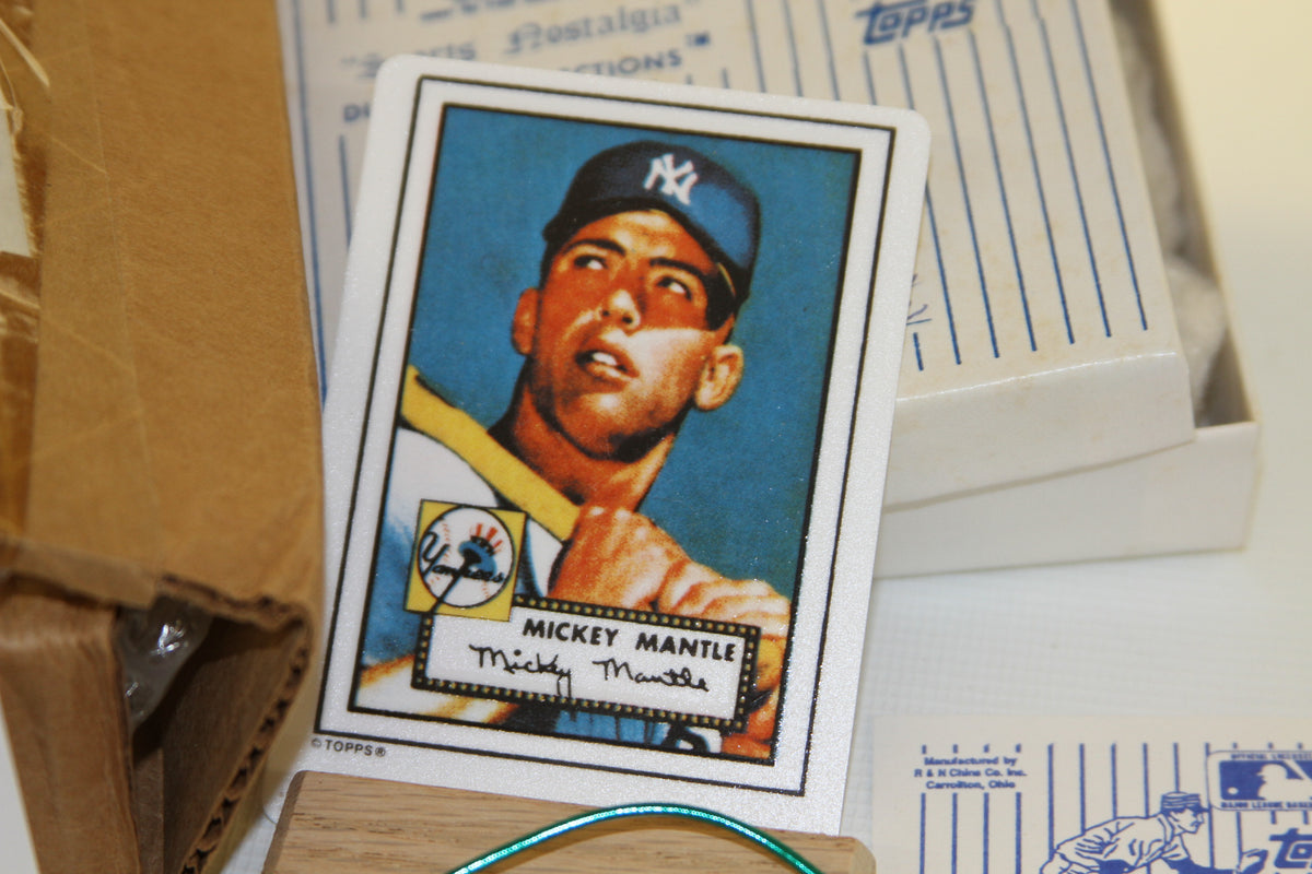 Front view of Mickey Mantle Topps porcelain card with packaging in background