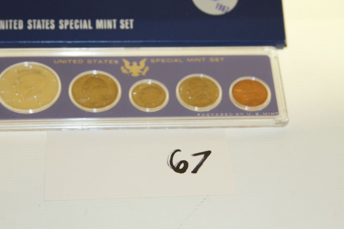 Full view of 1967 Special Mint Set showing five U.S. coins in protective case