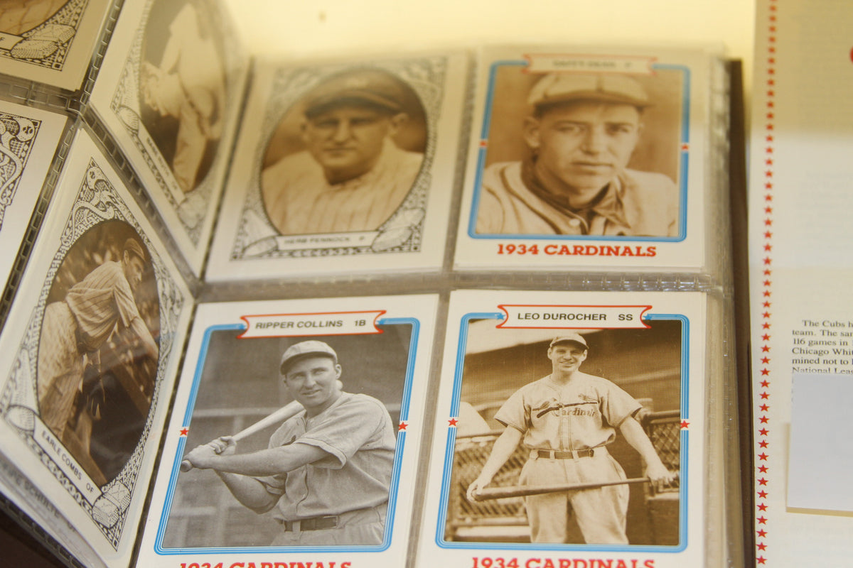 Baseball cards of 1934 Cardinals and others in plastic sleeves
