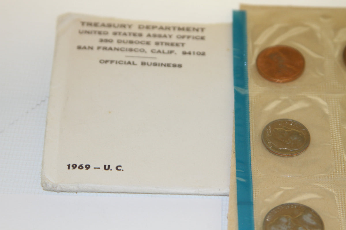 Envelope from United States Assay Office San Francisco next to sealed coins