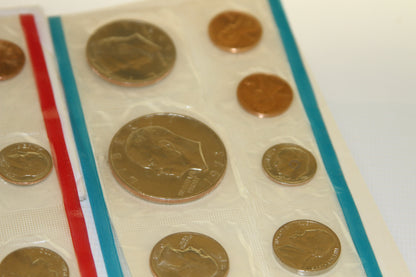 Detailed view of uncirculated coins in blue-edged mint packaging from 1973 set