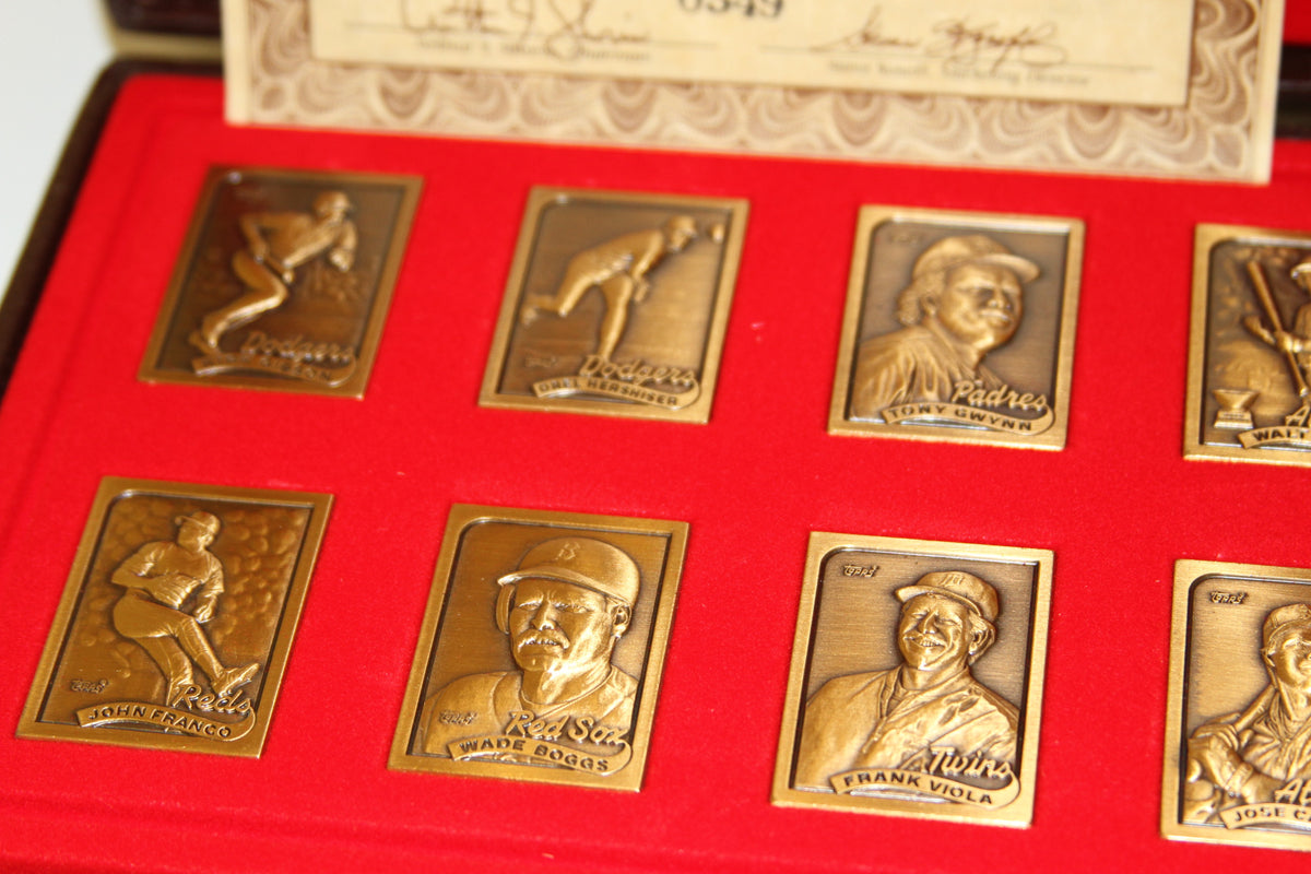 Close-up of Topps 1989 bronze baseball card replicas featuring players and teams