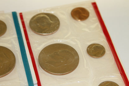 Detailed image of large U.S. coins from the 1976 set in red sleeve
