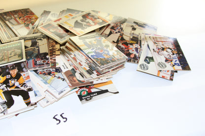 Angled shot focusing on NHL hockey trading cards, including a visible 'Kevin Todd' rookie card.