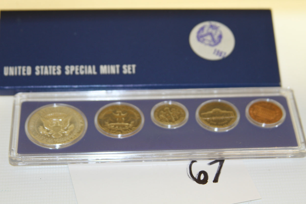 Reverse sides of all five 1967 Special Mint Set coins with blue U.S. Mint box