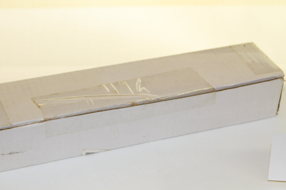 Side view of sealed white cardboard Topps box