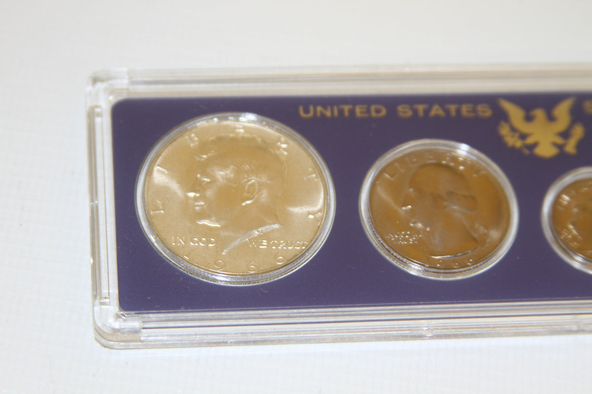 Detail showing Kennedy half dollar and Washington quarter from 1966 Mint Set