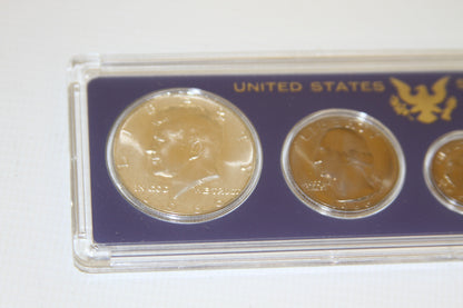 Detail showing Kennedy half dollar and Washington quarter from 1966 Mint Set