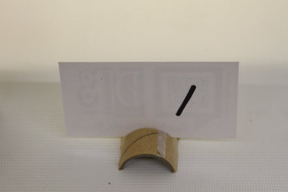 Card holder with blank white card and black slash mark