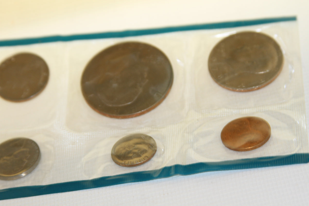 Sealed coins from the 1978 U.S. Mint set with blue border, showing various denominations