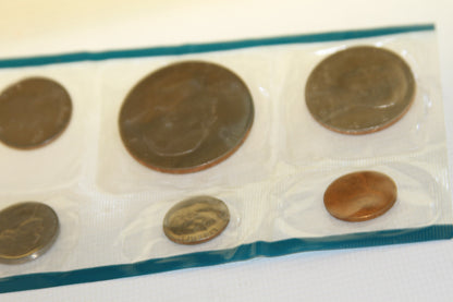 Sealed coins from the 1978 U.S. Mint set with blue border, showing various denominations