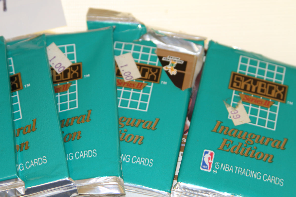 Detailed view of multiple SkyBox Series II Inaugural Edition basketball card packs