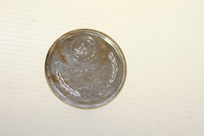 Back side of coin showing Keystone State and Mountain Laurel design