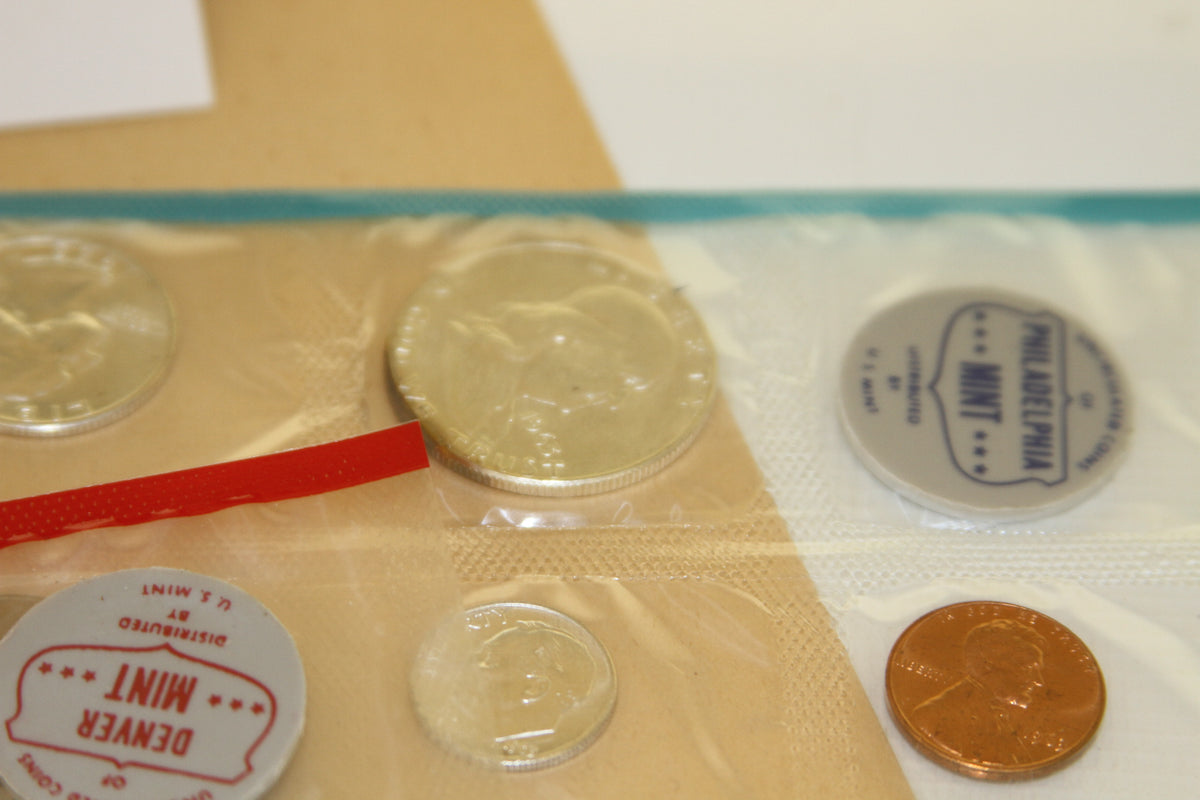 Franklin half and cent coins from both mints in cellophane