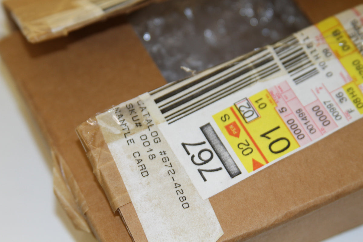 Close-up of shipping box label with SKU and barcode for Mantle card