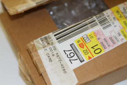 Close-up of shipping box label with SKU and barcode for Mantle card