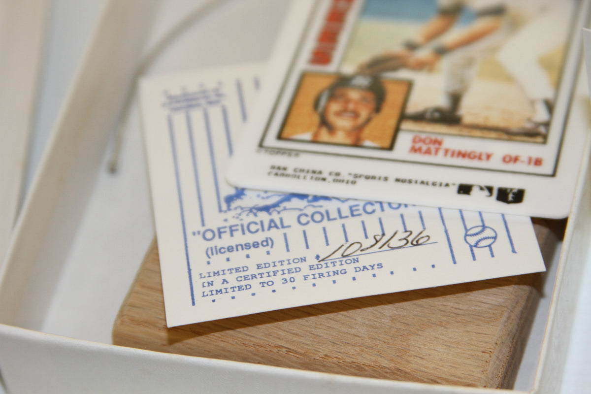 Numbered certificate and porcelain Don Mattingly Topps card in box
