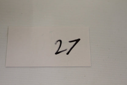 White card with handwritten number 27