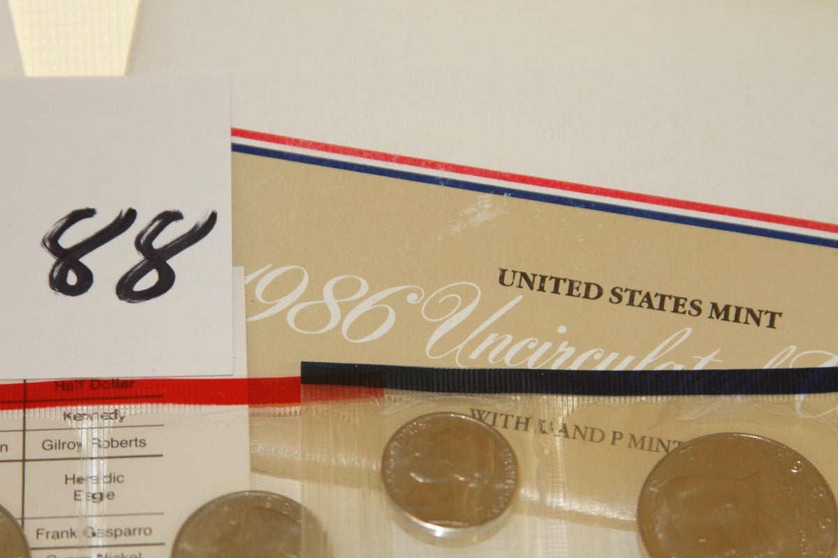 1986 uncirculated coin set packaging and coins with handwritten number 88