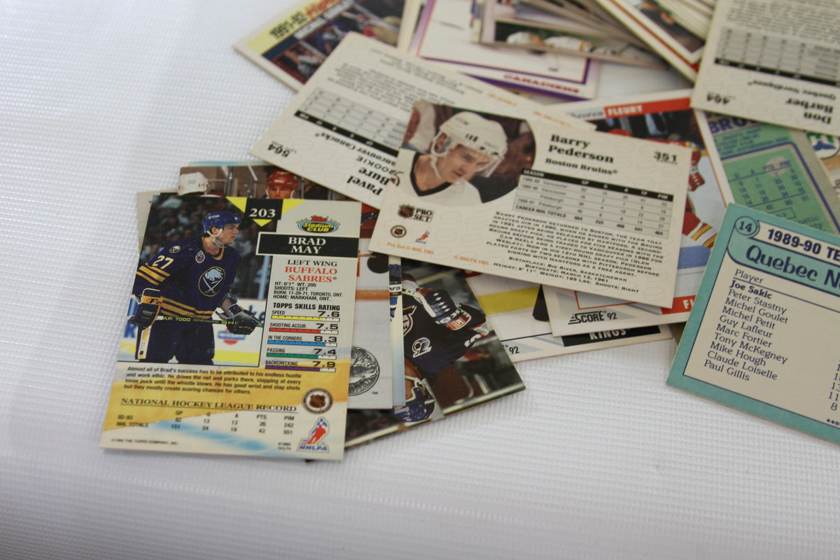 Random cards highlighted, including a Score card showing Brad May and various card backs.