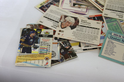 Random cards highlighted, including a Score card showing Brad May and various card backs.