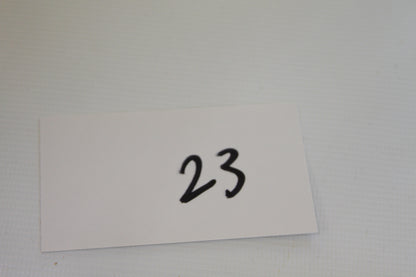 White card with handwritten number 23