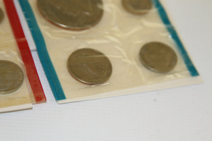 Corner view of U.S. Mint 1975 coins in blue-sealed package