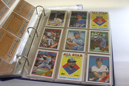 Binder with Topps cards including Kirby Puckett, Bruce Hurst, and others