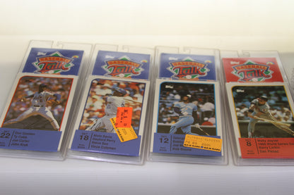 Four Topps Sports Talk baseball card sets in individual plastic cases
