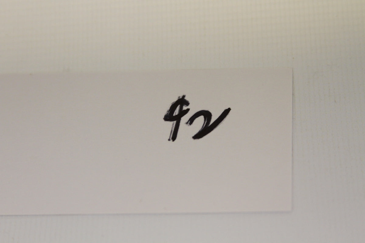 Handwritten white card with dollar sign and notation