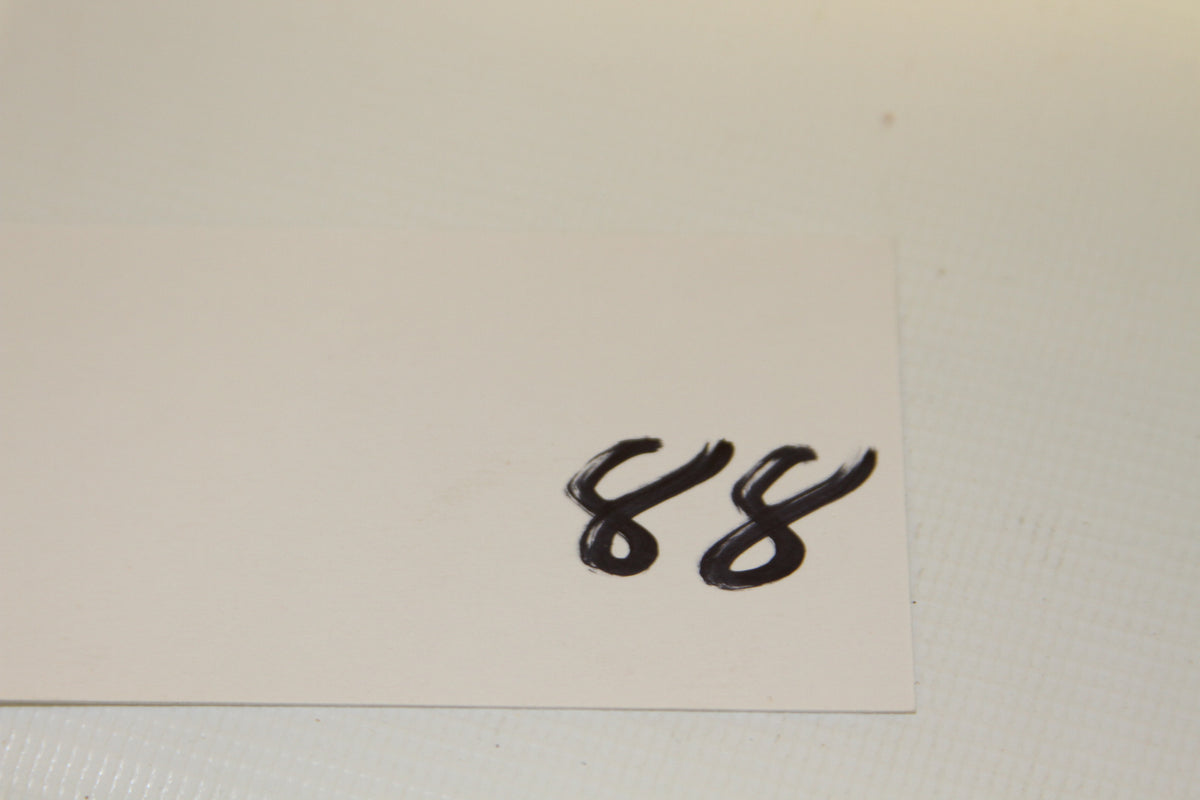 Blank white card with handwritten number 88