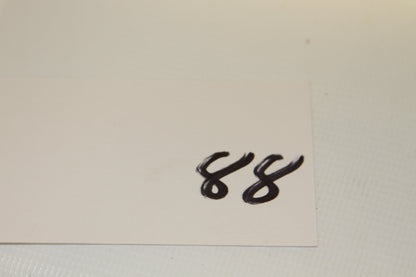 Blank white card with handwritten number 88