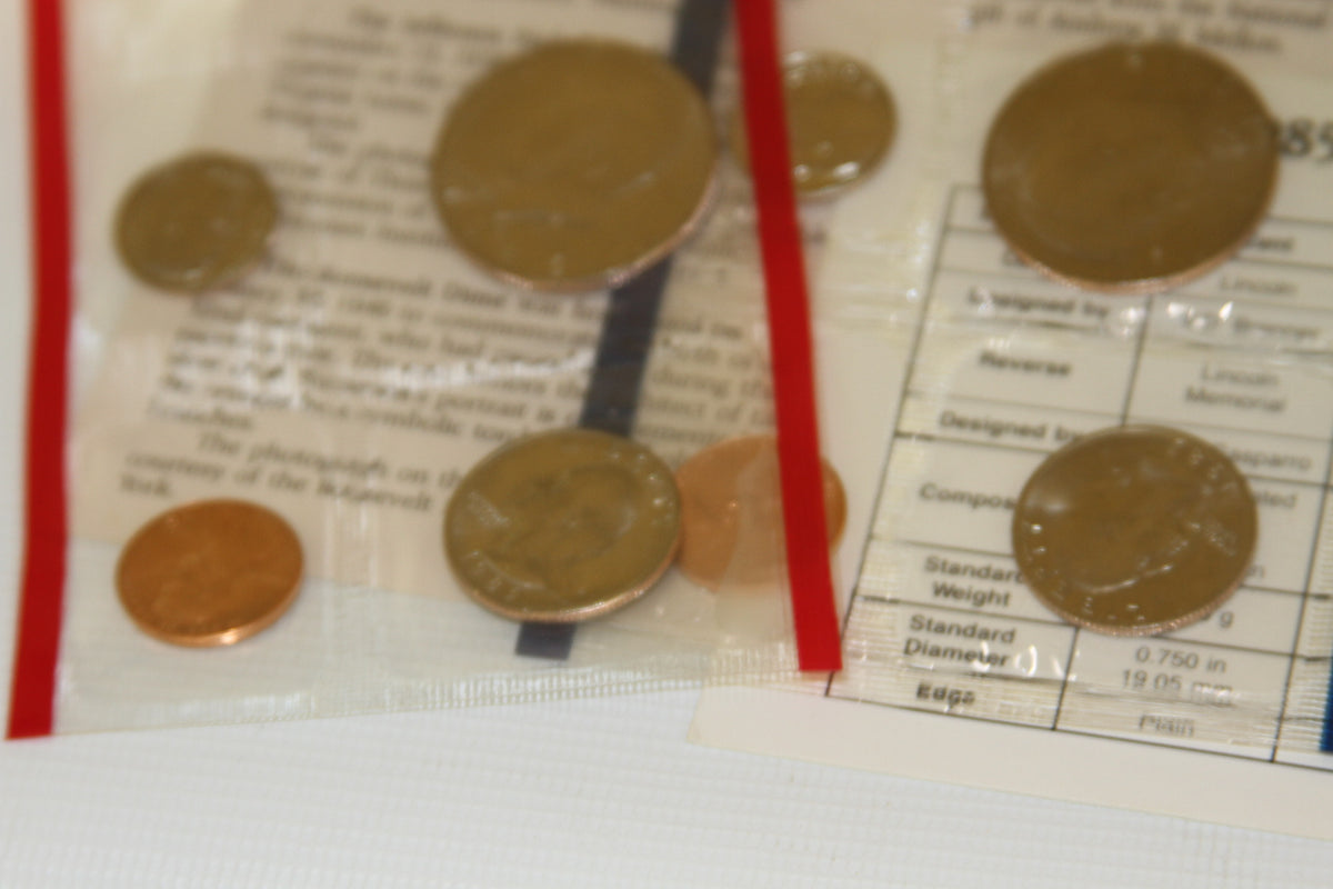 Sealed 1985 US Mint coins and details card viewed from above