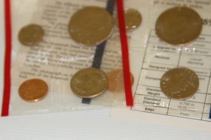 Sealed 1985 US Mint coins and details card viewed from above