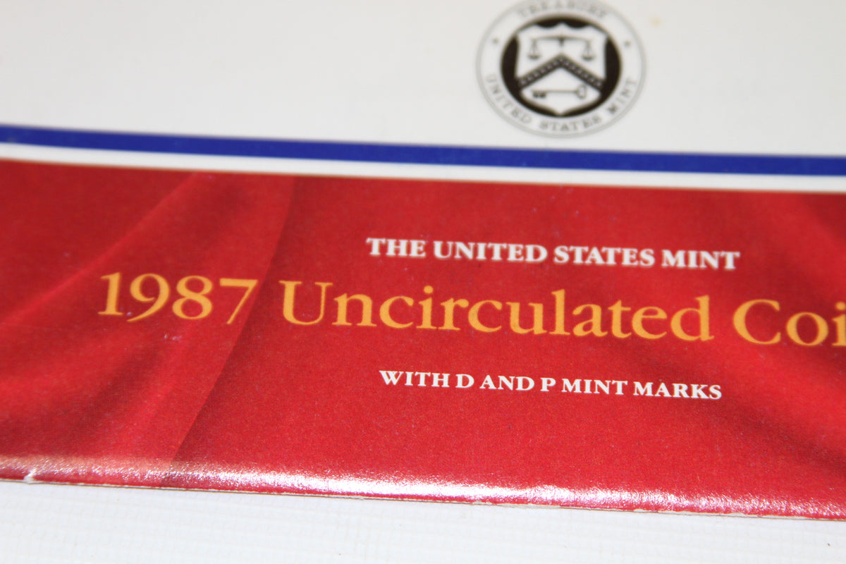 Close-up of red packaging with 1987 Uncirculated Coin Set text and US Mint seal
