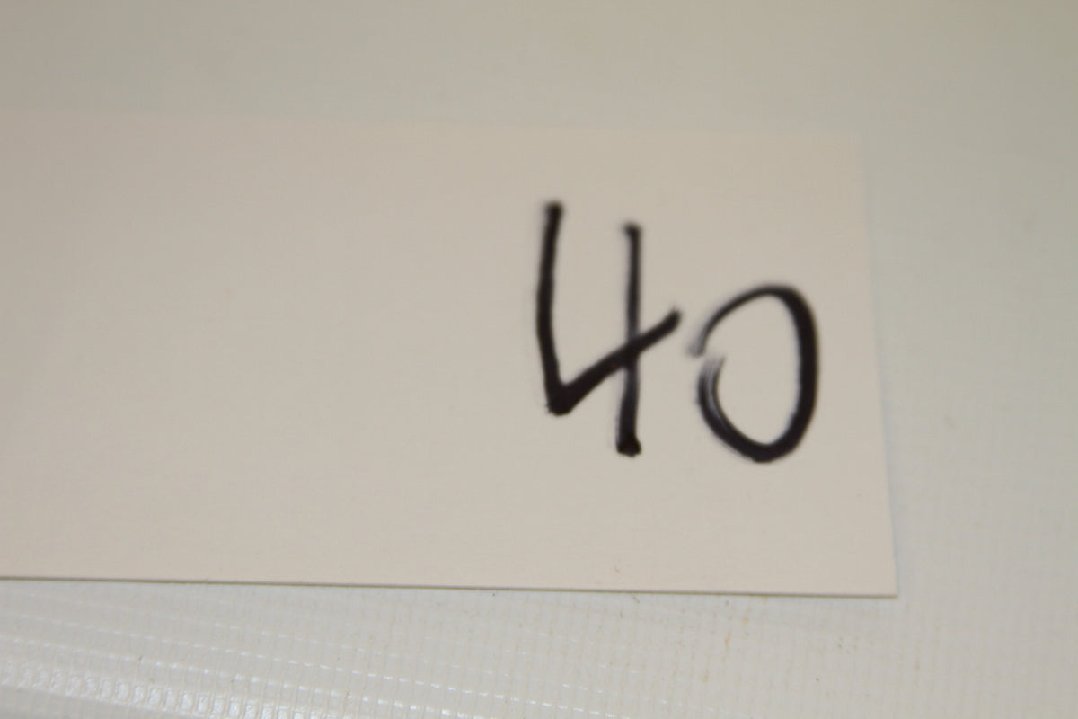 White card with handwritten number 40