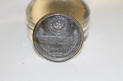 Back view of coin with state flower, laurel wreath, and Keystone State text