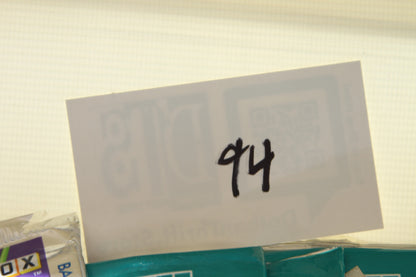 Number 94 card positioned above the basketball card packs