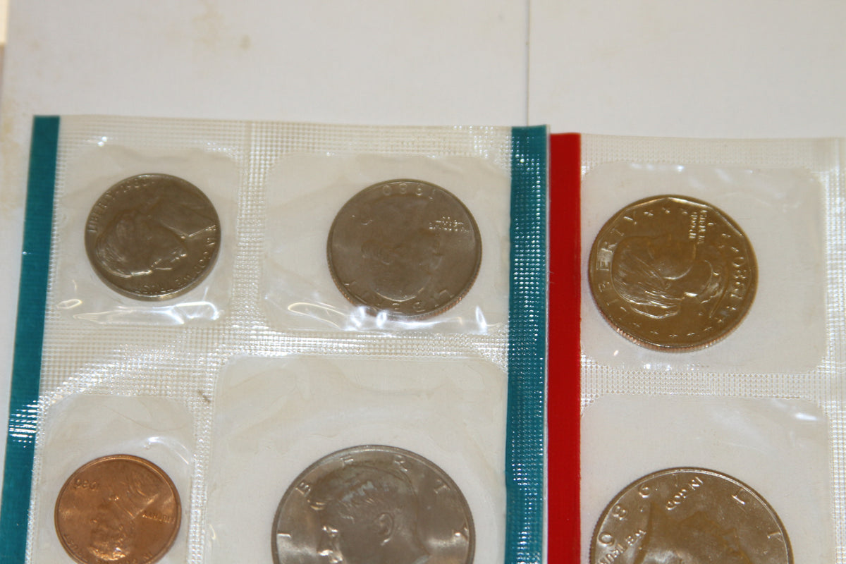 Top section of Mint set with various uncirculated coins in plastic sleeves
