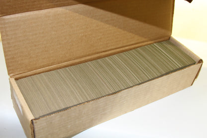 Open box revealing large stack of 1985 Topps baseball cards inside