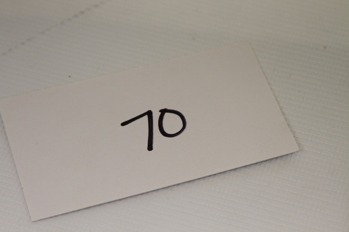 Number card showing lot 70 for inventory identification
