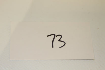 Inventory card labeled 73 for coin set
