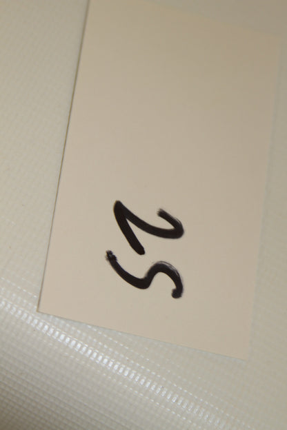 Closeup of handwritten card labeled 25
