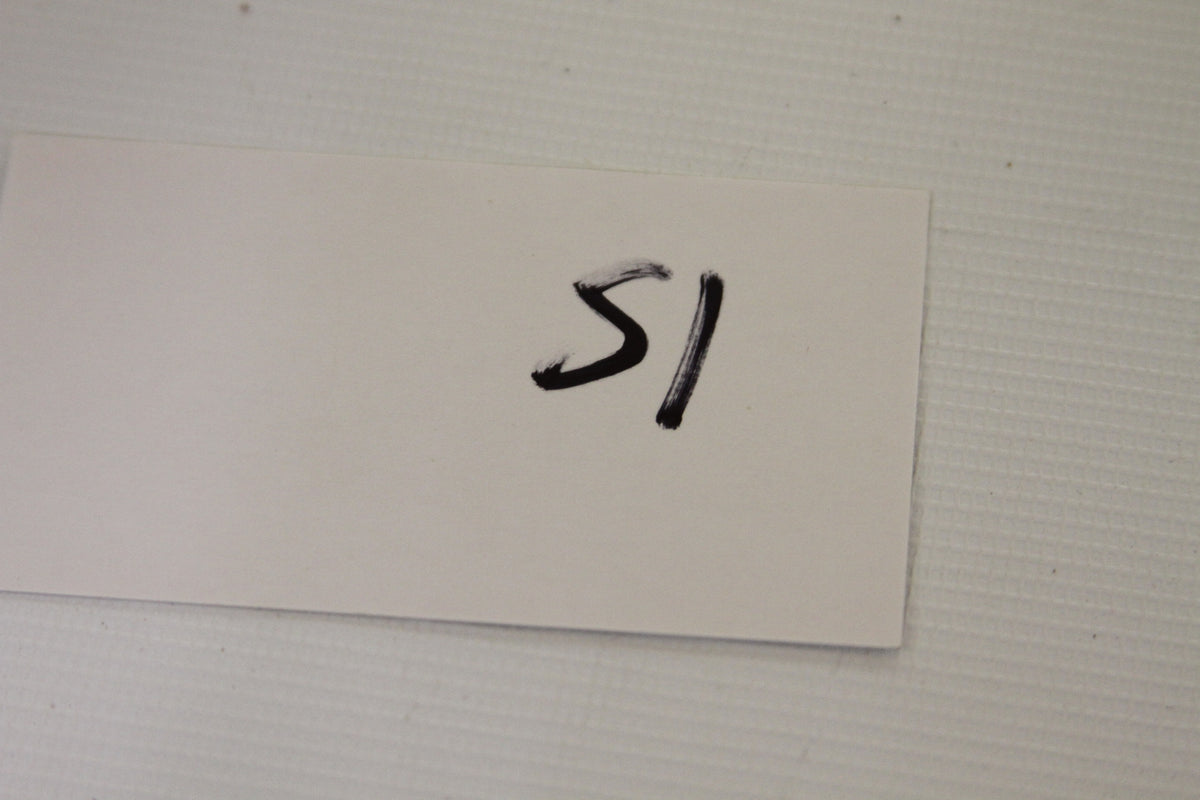 White index card labeled with the number 51