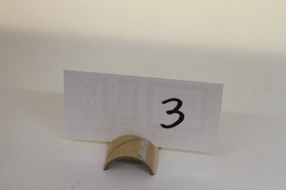 Cardboard stand with handwritten number 3