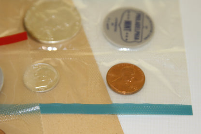 Lincoln cent and Philadelphia Mint token in original 1963 cellophane pack