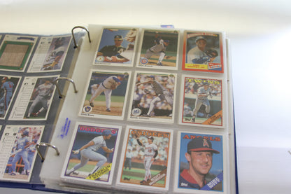 Binder page with Topps and Upper Deck baseball cards, featuring Ken Griffey Jr. and Randy Johnson